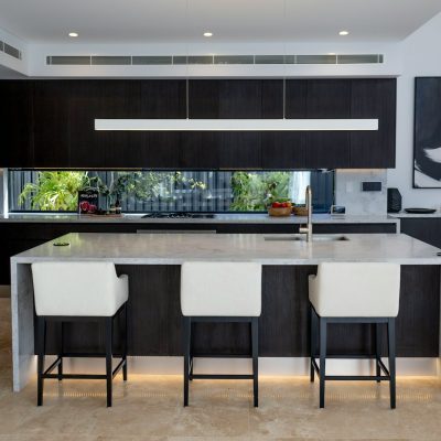 a kitchen with black cabinets